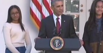 President Obama w- Sasha and Malia pardons turkey Honest & Abe.