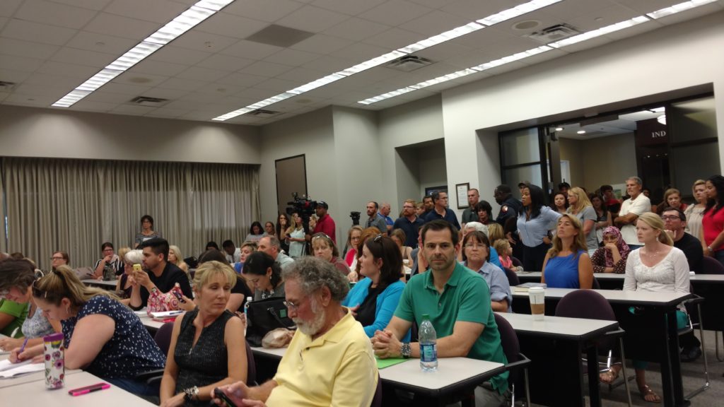Large crowd of Humble ISD Parents at school board meeting
