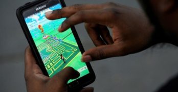 File photo of a virtual map of Bryant Park displayed on the screen as a man plays the augmented reality mobile game "Pokemon Go" by Nintendo in New York City