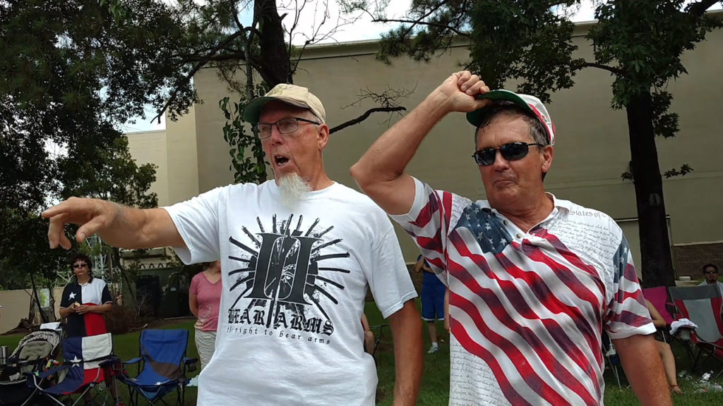4th of July parade watchers threatning marchers with 2nd Amendment