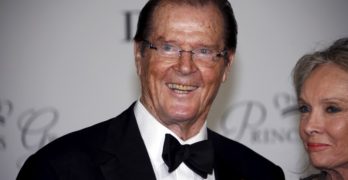 FILE PHOTO: British actor Roger Moore and his wife Kristina Tholstrup arrive at the Princess Grace Awards gala in Monaco