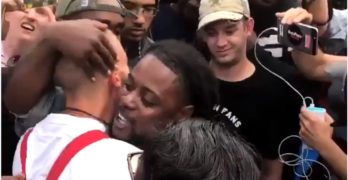 Black protester hugs white supremacist & he doesn't know what to do (VIDEO)