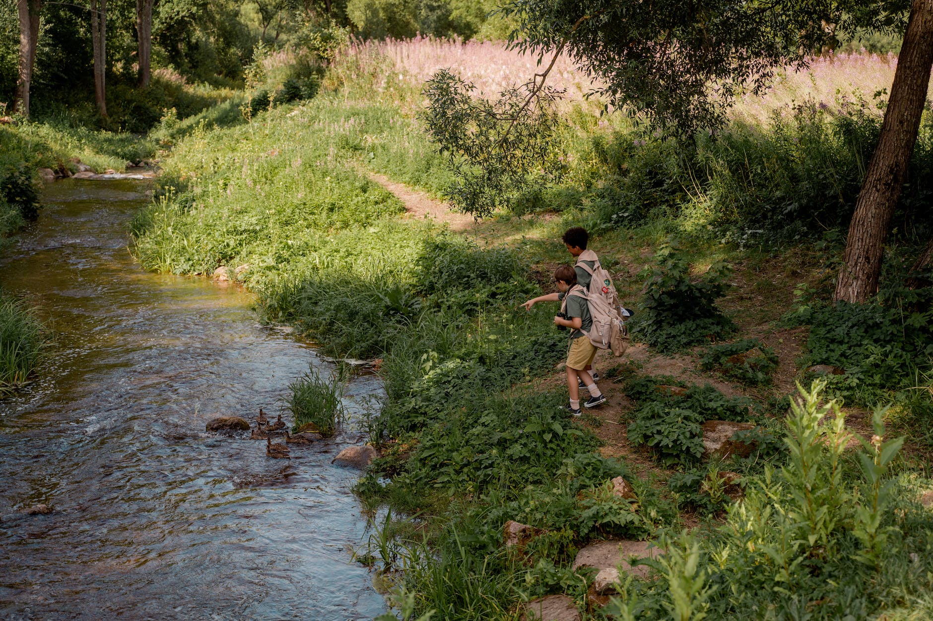 boy scouts standing near a river