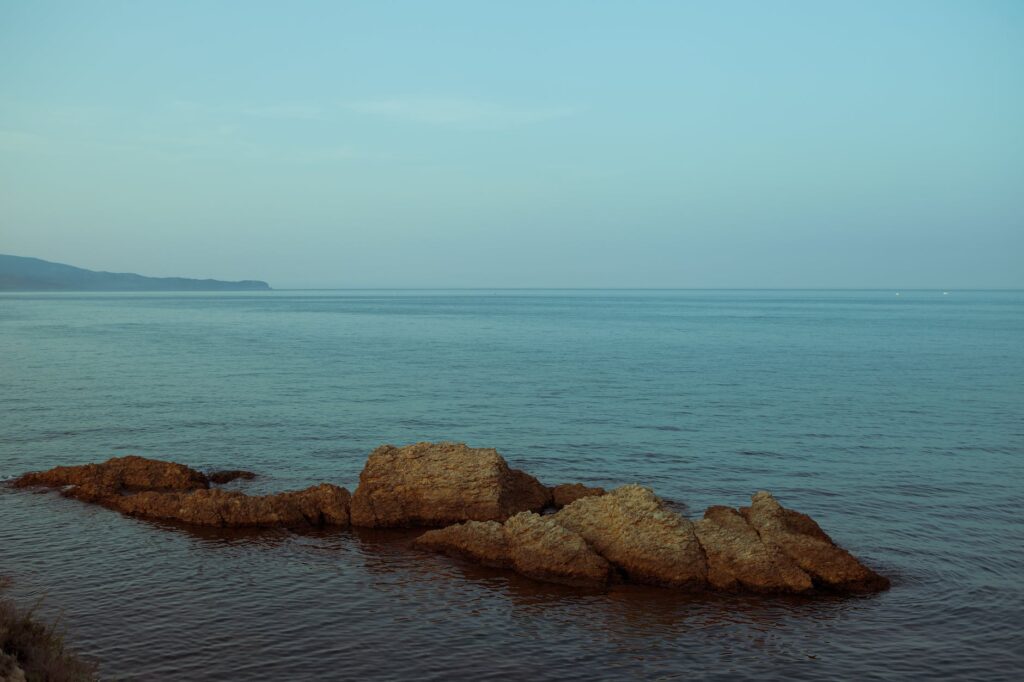 rocks protruding from the waters of the ocean